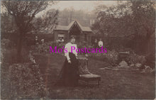 Load image into Gallery viewer, Ancestors Postcard - Lady Posing Next to a Chair in a Garden SW14879