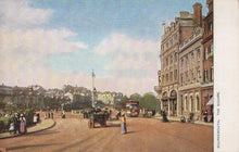 Load image into Gallery viewer, Vintage street scene with people, vehicles, and buildings in a town square.