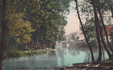 Load image into Gallery viewer, River scene with trees and buildings in the background