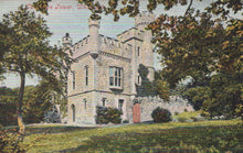 Load image into Gallery viewer, Stone tower with decorative architecture in a park-like setting