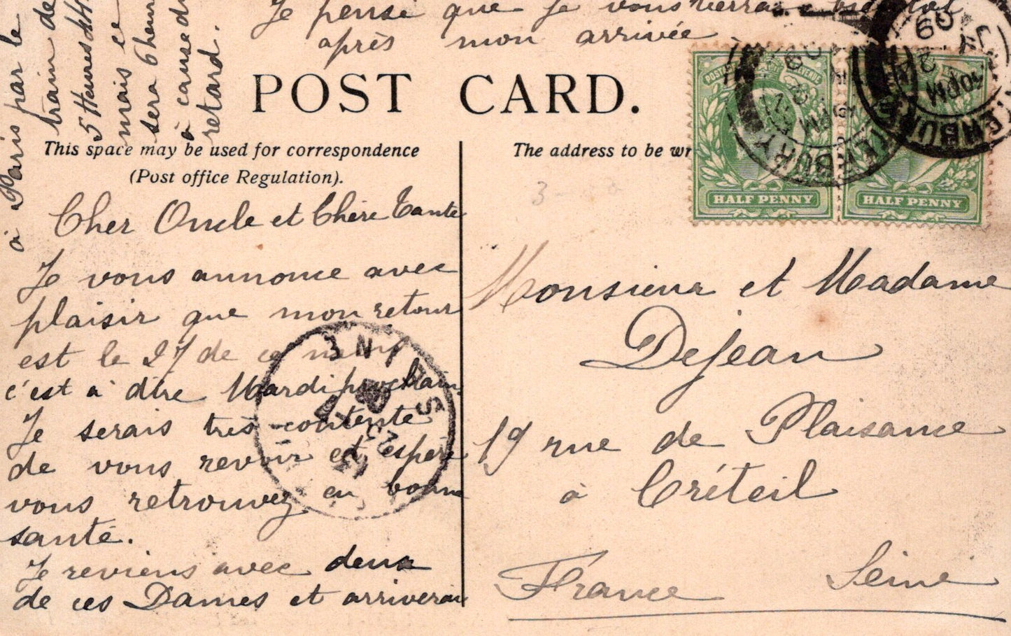 Vintage postcard with stamps and cursive writing, featuring a green stamp and a red stamp.