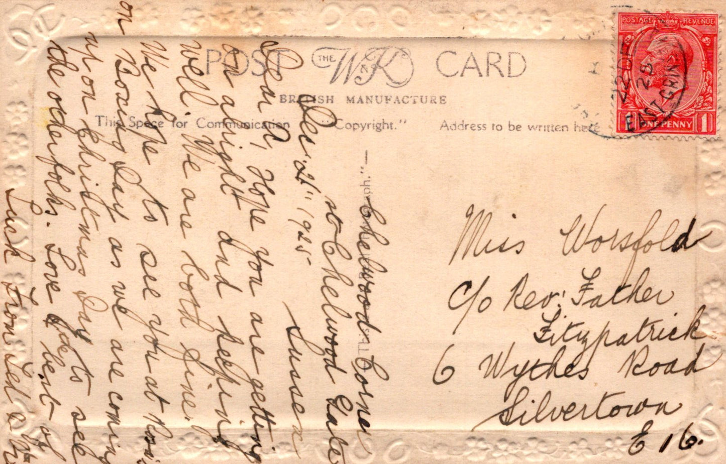Vintage postcard with handwritten text and a red stamp