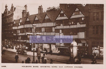 Load image into Gallery viewer, Vintage black and white photo of Holborn Bars with old London houses and a prominent sign.