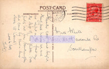 Load image into Gallery viewer, Vintage postcard with handwritten text and a red stamp on a beige background