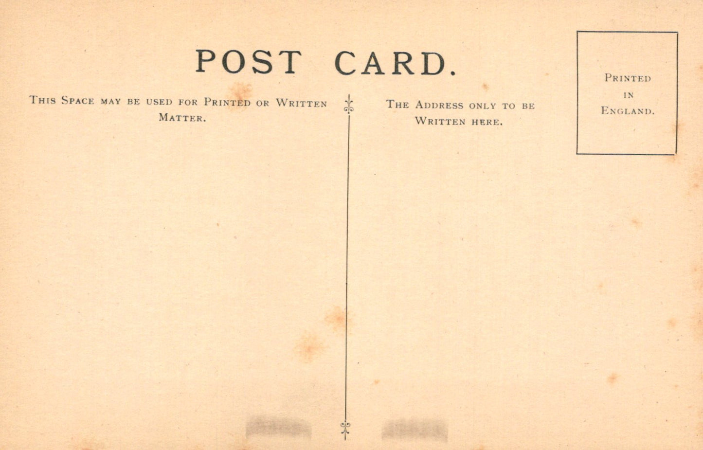 Vintage postcard with text and a line dividing the front and back