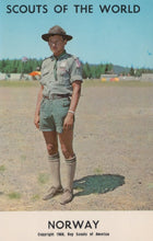 Load image into Gallery viewer, Scout in uniform standing on a grassy field with 'Scouts of the World' and 'Norway' text at the top.