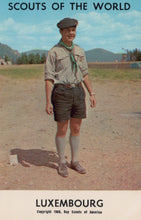 Load image into Gallery viewer, Vintage photograph of a scout in Luxembourg with mountains in the background