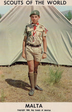 Load image into Gallery viewer, Scout in uniform standing in front of a tent with 'Scouts of the World' and 'Malta' text.