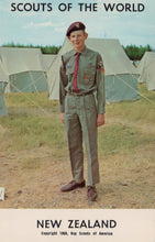 Load image into Gallery viewer, Scout in uniform standing in front of tents with 'Scouts of the World' and 'New Zealand' text.