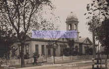 Load image into Gallery viewer, Vintage photograph of a school building with a clock tower, surrounded by trees.