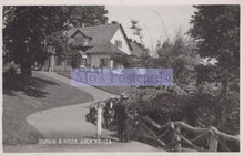 Load image into Gallery viewer, Vintage black and white photo of a house with a person walking a horse, labeled 'Mo's Postcards'.