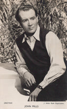 Load image into Gallery viewer, Black and white portrait of a man in a vest and shirt against a natural background