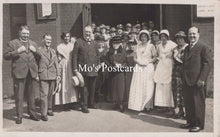 Load image into Gallery viewer, Vintage black and white photo of a group of people posing outdoors