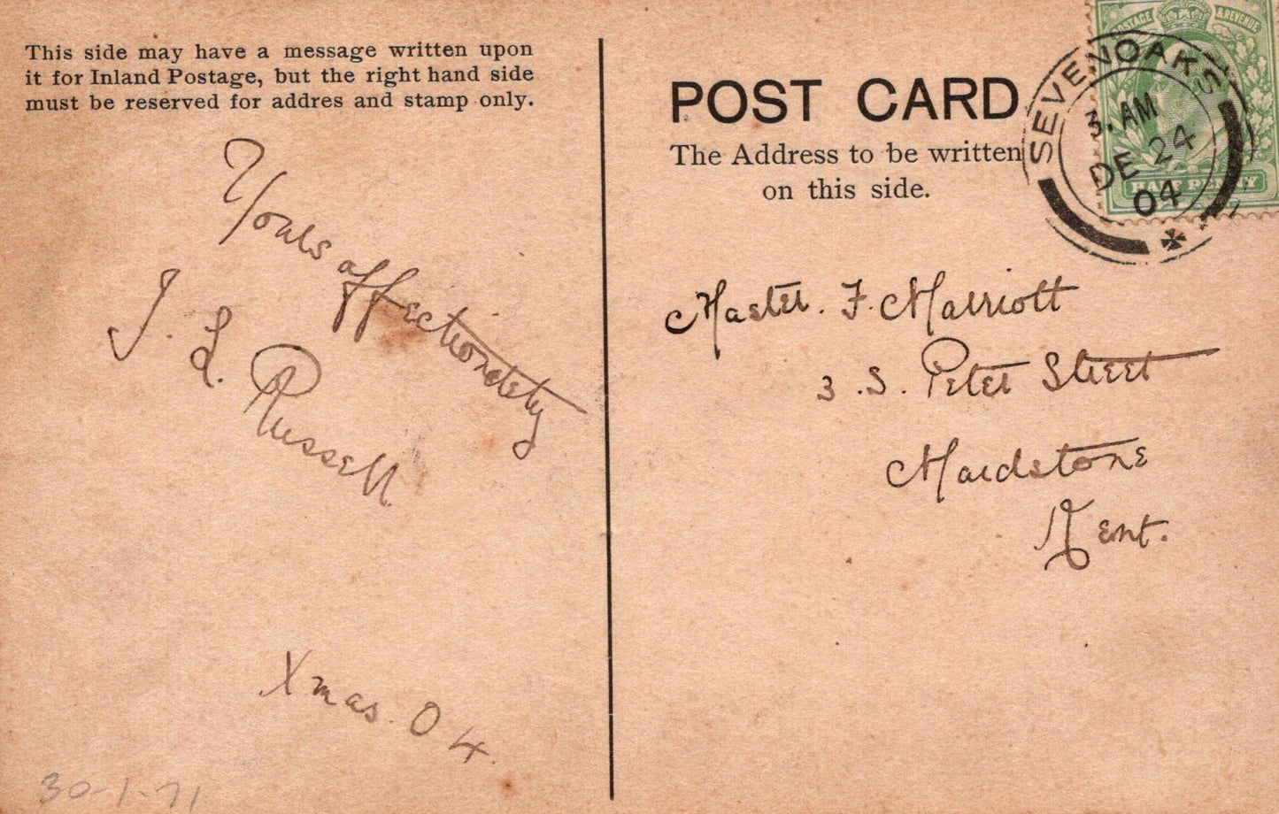 Vintage postcard with handwritten text and a stamp, featuring a brown background.