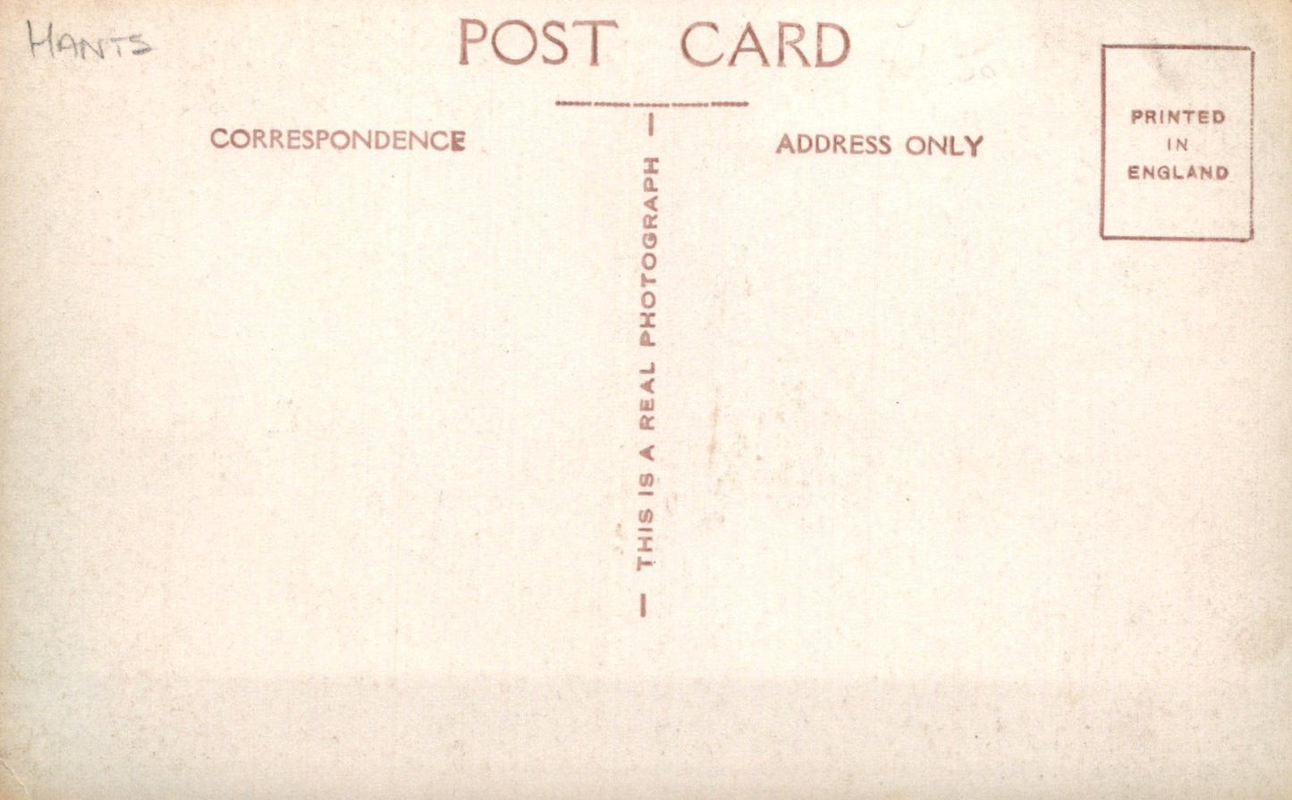 Back of a postcard with text about correspondence and photography, printed in England.