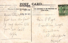 Load image into Gallery viewer, Vintage postcard with handwritten text and a stamp, addressed to Brighton.