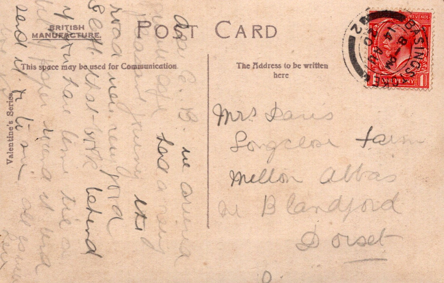 Vintage postcard with handwritten text and a red stamp on a beige background