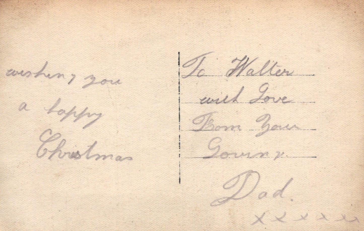 Handwritten Christmas message on a vintage card with decorative elements.
