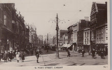Load image into Gallery viewer, Vintage black and white photograph of St. Mary Street, Cardiff with pedestrians and streetcars.