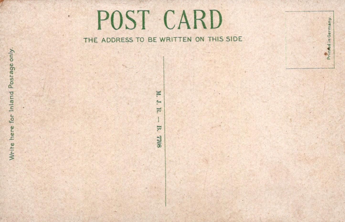 Back of a vintage postcard with text and a grid pattern
