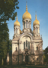 Load image into Gallery viewer, Russian Orthodox church with gold domes in a park-like setting