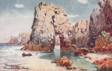 Load image into Gallery viewer, Vintage-style postcard of a coastal scene with large rocks and a boat on a beach