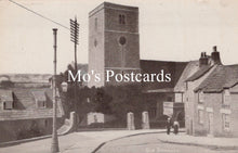 Load image into Gallery viewer, Vintage black and white photo of a street scene with a church tower and buildings