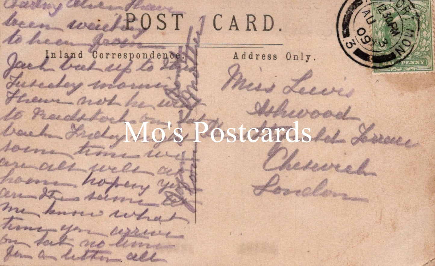 Vintage postcard with handwritten text and a stamp