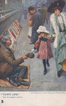 Load image into Gallery viewer, Vintage postcard of a pavement artist selling paintings to a woman and child in an urban setting.