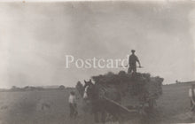 Load image into Gallery viewer, Vintage black and white photo of a horse-drawn cart with people in a field, labeled 'Postcard'.