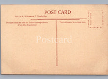 Load image into Gallery viewer, Back of a vintage postcard with printed text and a brown background