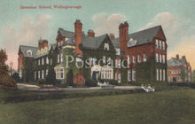 Load image into Gallery viewer, Colorized postcard of a large brick building with 'Grammar School, Wellingborough' text.