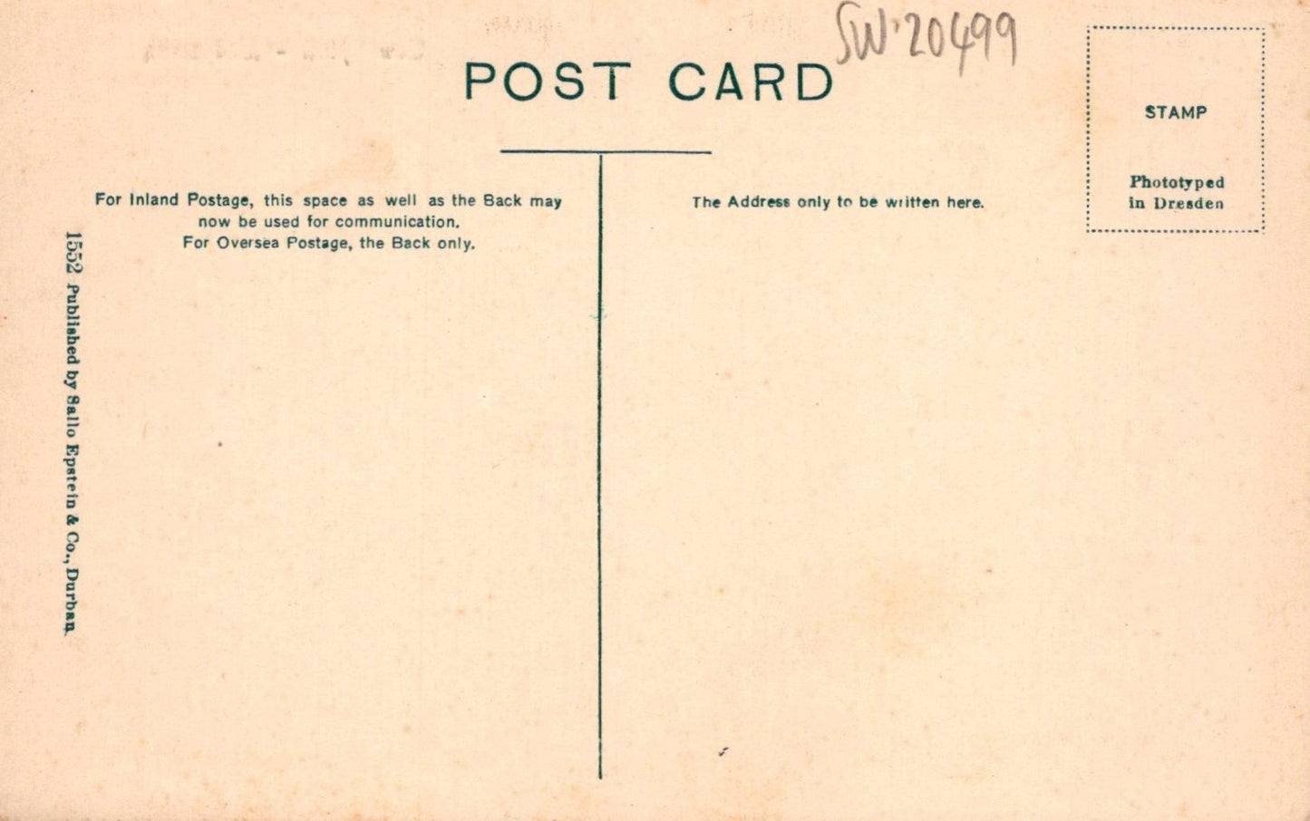 Back of a vintage postcard with text and a stamp