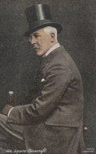 Load image into Gallery viewer, Man in formal attire with a top hat and smoking a pipe, sitting.