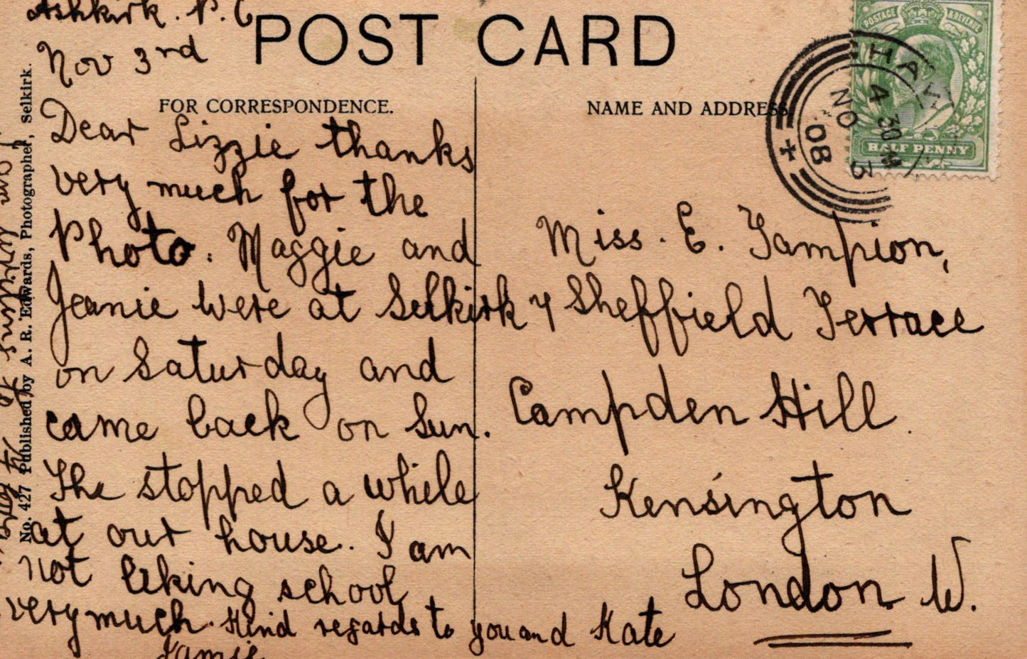 Vintage postcard with handwritten text and a stamp, featuring a brown background.