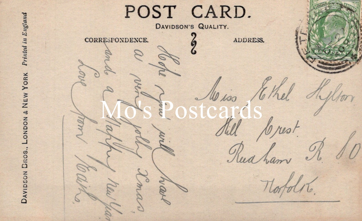 Vintage postcard with handwritten text and a stamp.