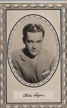 Load image into Gallery viewer, Vintage black and white portrait of a man in a suit with decorative frame and signature at the bottom.