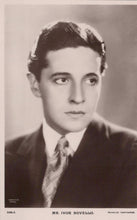 Load image into Gallery viewer, Vintage black and white portrait of a man in formal attire with a plain background