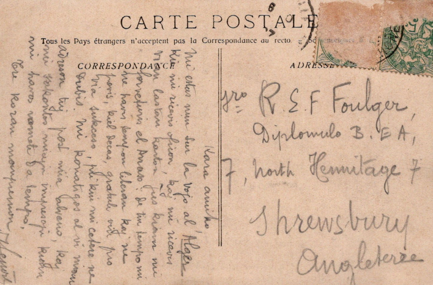 Vintage postcard with text and stamps, featuring a handwritten address.