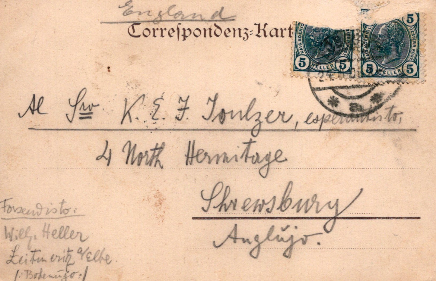Vintage postcard with postage stamps and handwritten text on a light brown background