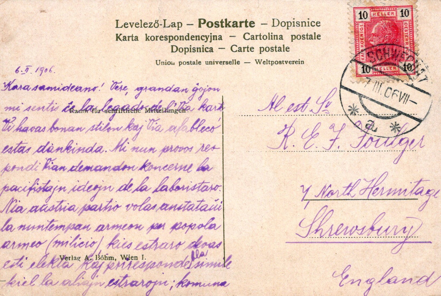 Vintage postcard with text and postage stamp, featuring a black stamp and red postmark.