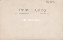 Load image into Gallery viewer, Ancestors Postcard - Young Girl Stood Next to an Ornate Wooden Chair SW16846