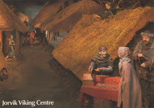 Load image into Gallery viewer, Viking scene with people around a table in a village setting, featuring thatched roofs and wooden huts.