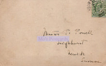 Load image into Gallery viewer, Vintage postcard with handwritten address and a stamp on a brown background