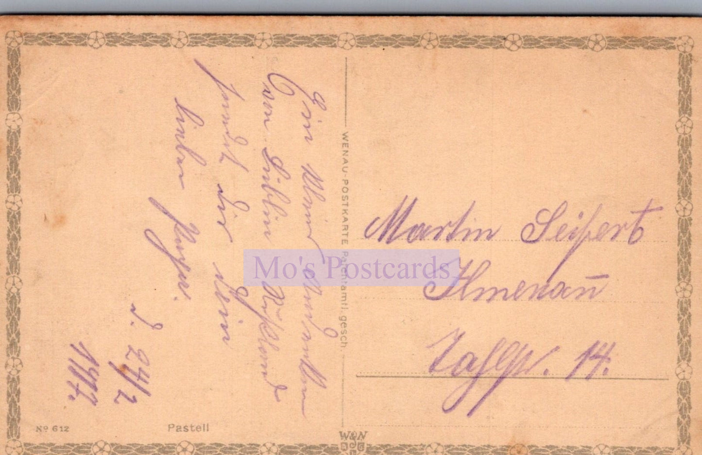 Vintage postcard with handwritten text on a beige background
