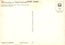 Load image into Gallery viewer, Back of a postcard with text and a logo, featuring a light yellow background.