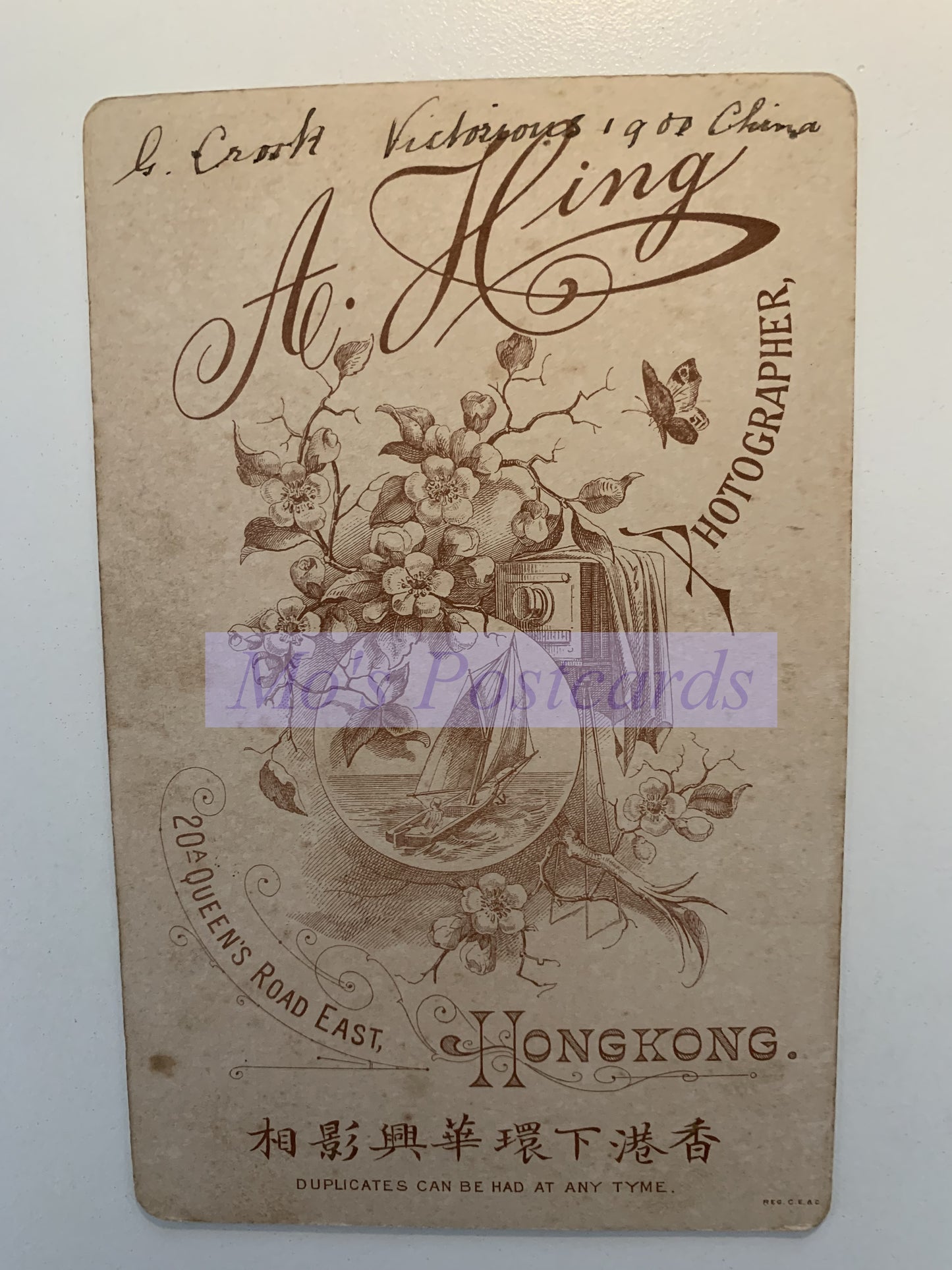 Vintage-style photo card with decorative elements and text on a white background