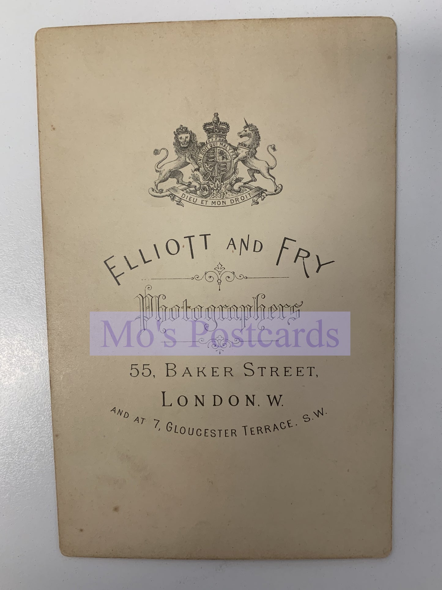 Vintage card with Elliott and Fry photographers logo and address on a white background