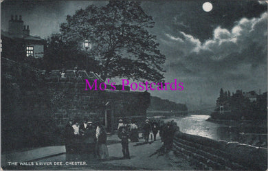 Vintage black and white postcard of a moonlit scene by a river with people on a bridge.