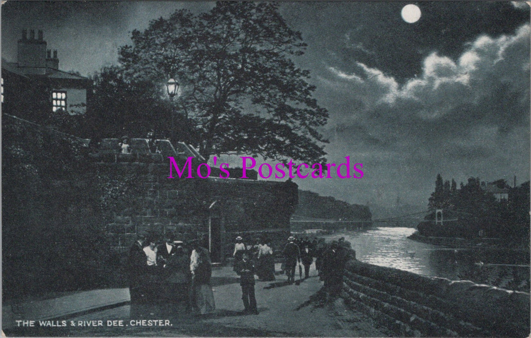 Vintage black and white postcard of a moonlit scene by a river with people on a bridge.